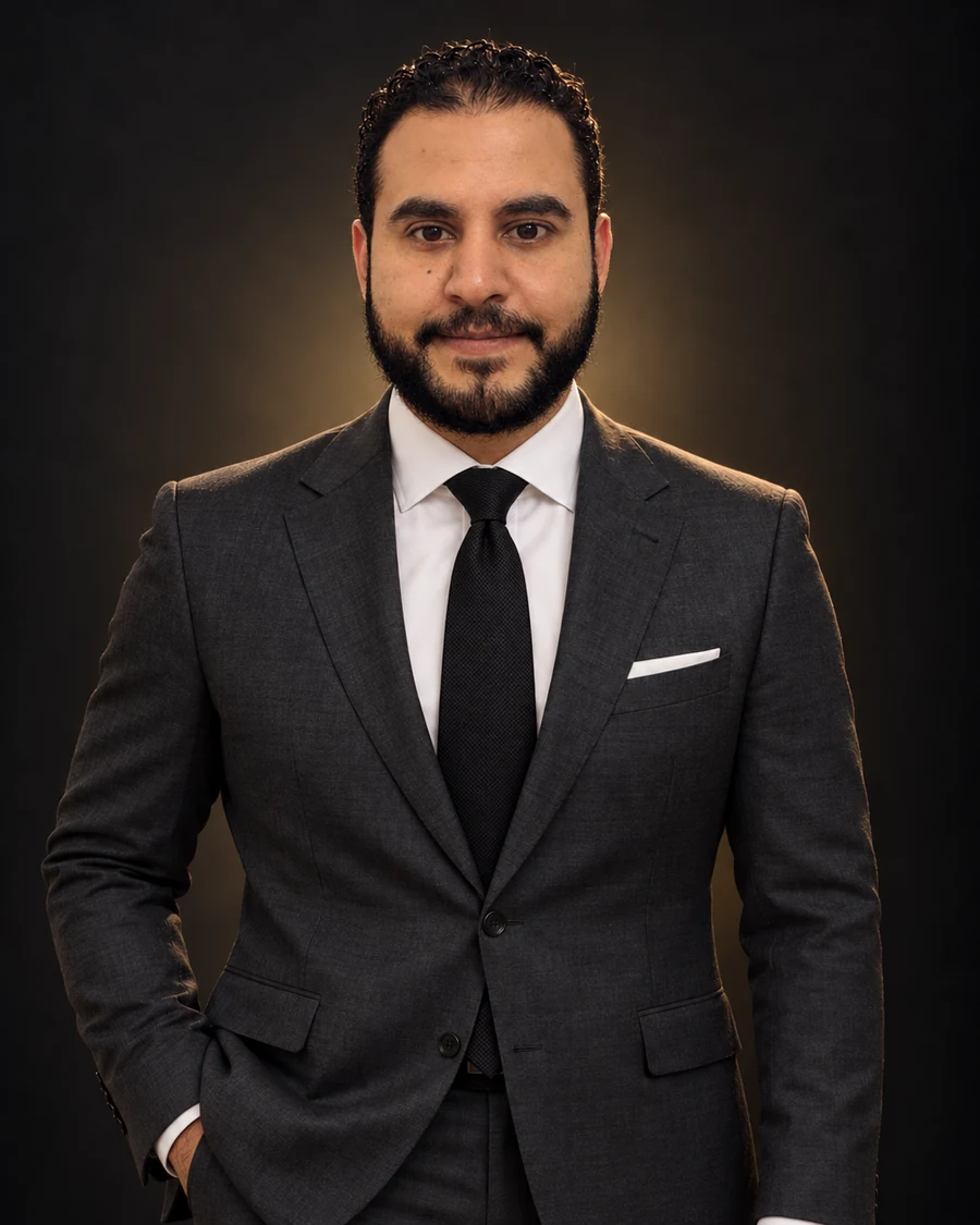 Mohamed Abo Younes in a charcoal suit