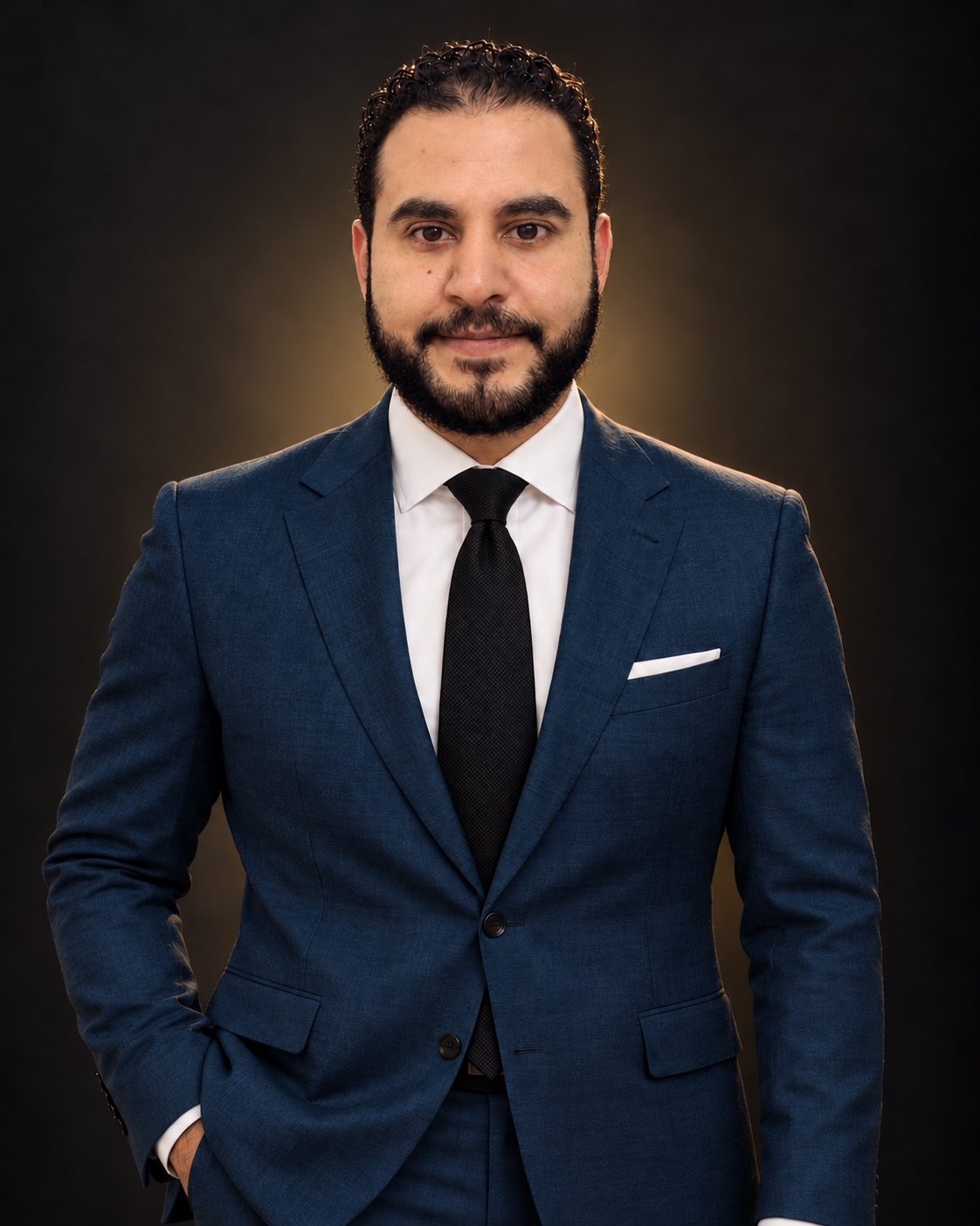 Mohamed Abo Younes in a petrol-blue suit